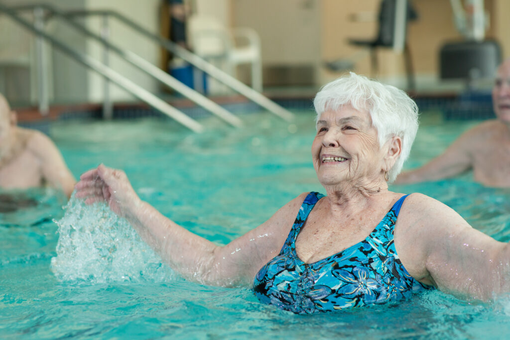 smiling-resident-enjoying-water-aerobics