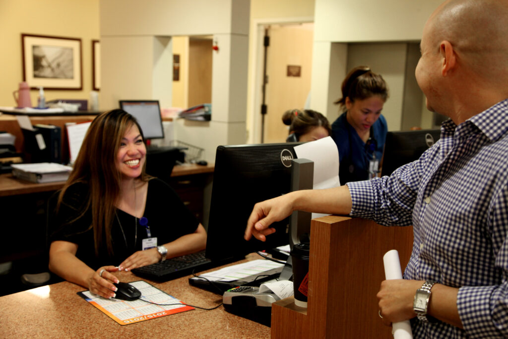 welcoming-staff-member-greets-client