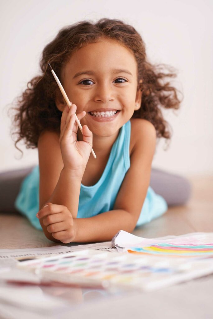 smiling-little-girl-painting
