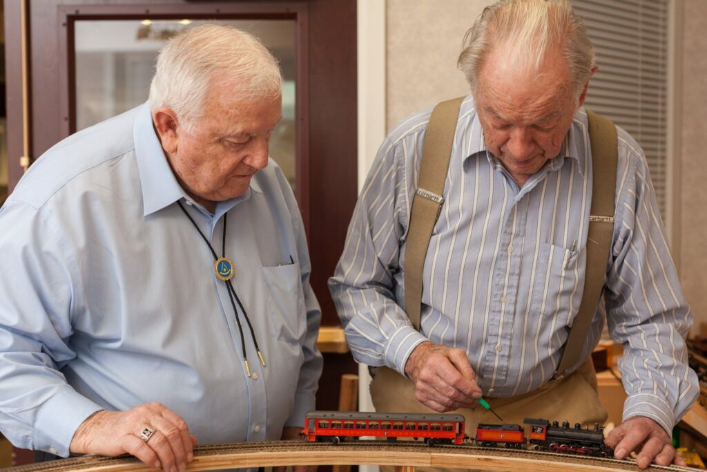 Two-Men-Fixing-a-Model-Train-1536x1024